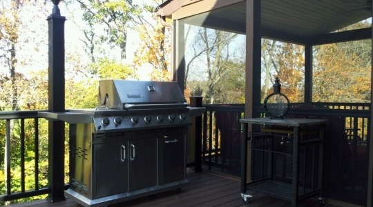 Outdoor living spaces with cozy seating and fire pit.